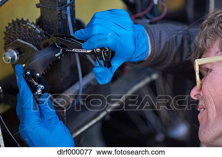 Bicycle taxi driver fixing his vehicle, Salt Like City, USA View Large Photo Image Stock Photo - Bicycle taxi driver fixing his vehicle, Salt Like City, USA. Fotosearch