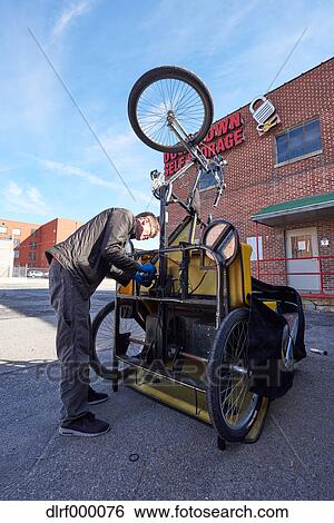 Bicycle taxi driver fixing his vehicle, Salt Like City, USA View Large Photo Image Stock Photograph - Bicycle taxi driver fixing his vehicle, Salt Like City, USA. Fotosearch