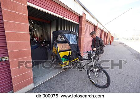 Bicycle taxi driver fixing his vehicle, Salt Like City, USA View Large Photo Image Stock Photography - Bicycle taxi driver fixing his vehicle, Salt Like City, USA. Fotosearch