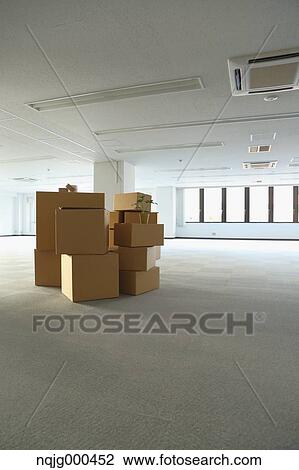 Boxes in an empty office View Large Photo Image Stock Image - Boxes in an empty office. Fotosearch