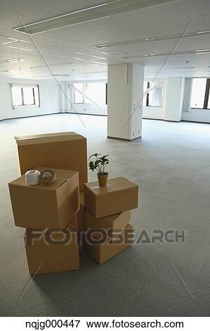 Boxes in an empty office View Large Photo Image Stock Photo - Boxes in an empty office. Fotosearch
