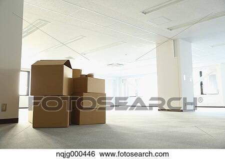 Boxes in an empty office View Large Photo Image Stock Photograph - Boxes in an empty office. Fotosearch