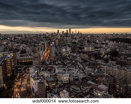 Dramatic sky over Tokyo cityscape before sunset, Tokyo, Japan View Large Photo Image Picture - Dramatic sky over Tokyo cityscape before sunset, Tokyo, Japan. Fotosearch