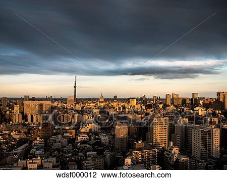 Stock Image - Dramatic sky over Tokyo cityscape before sunset, Tokyo, Japan. Fotosearch