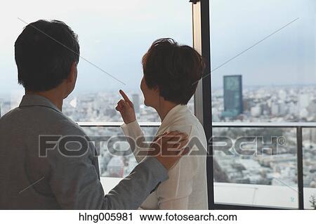 Fashionable Japanese senior couple by the window View Large Photo Image Stock Image - Fashionable Japanese senior couple by the window. Fotosearch