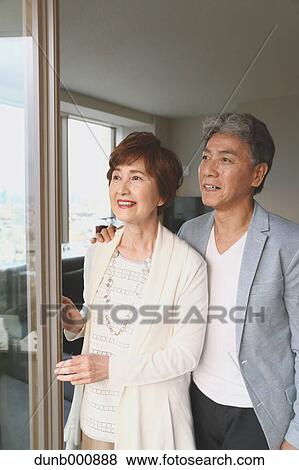 Fashionable Japanese senior couple by the window View Large Photo Image Stock Photo - Fashionable Japanese senior couple by the window. Fotosearch