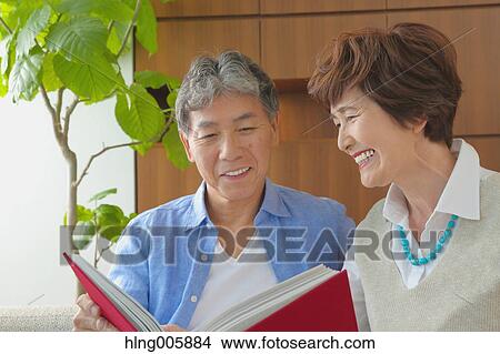 Fashionable Japanese senior couple on sofa View Large Photo Image Picture - Fashionable Japanese senior couple on sofa. Fotosearch