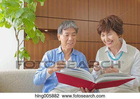 Fashionable Japanese senior couple on sofa View Large Photo Image Stock Image - Fashionable Japanese senior couple on sofa. Fotosearch