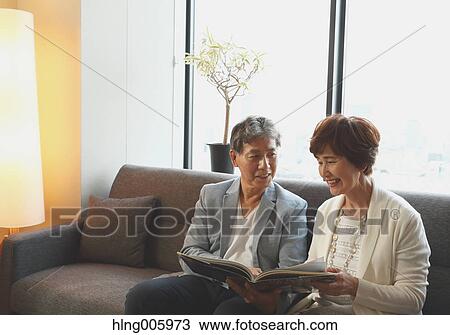 Fashionable Japanese senior couple on the sofa View Large Photo Image Stock Image - Fashionable Japanese senior couple on the sofa. Fotosearch