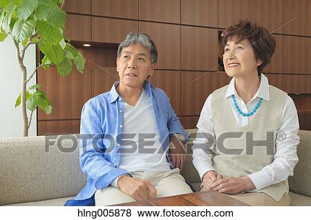 Fashionable Japanese senior couple on sofa View Large Photo Image Stock Photo - Fashionable Japanese senior couple on sofa. Fotosearch