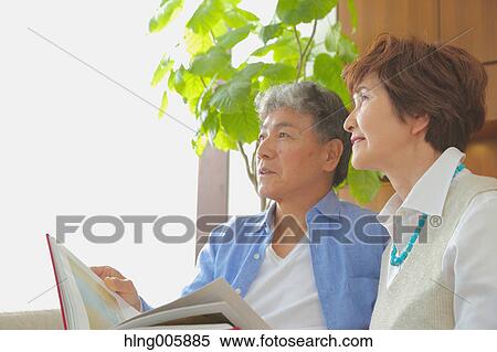 Fashionable Japanese senior couple on sofa View Large Photo Image Stock Photography - Fashionable Japanese senior couple on sofa. Fotosearch