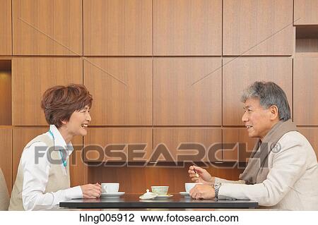 Fashionable Japanese senior couple enjoying a cup of coffee View Large Photo Image Stock Image - Fashionable Japanese senior couple enjoying a cup of coffee. Fotosearch
