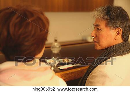 Fashionable Japanese senior couple having a good time at the restaurant View Large Photo Image Stock Image - Fashionable Japanese senior couple having a good time at the restaurant. Fotosearch
