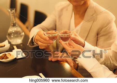 Fashionable Japanese senior couple having a good time at the restaurant View Large Photo Image Stock Image - Fashionable Japanese senior couple having a good time at the restaurant. Fotosearch