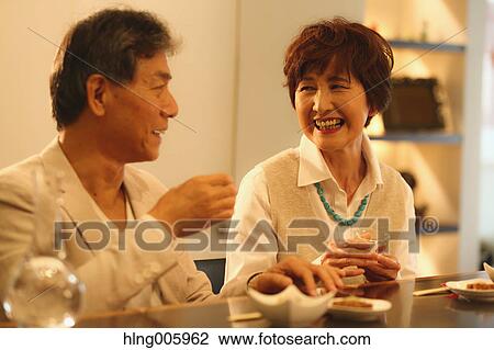 Fashionable Japanese senior couple having a good time at the restaurant View Large Photo Image Stock Image - Fashionable Japanese senior couple having a good time at the restaurant. Fotosearch