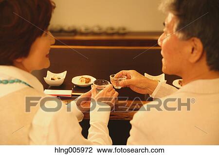 Fashionable Japanese senior couple having a good time at the restaurant View Large Photo Image Stock Image - Fashionable Japanese senior couple having a good time at the restaurant. Fotosearch