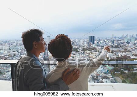 Fashionable Japanese senior couple enjoying Tokyo cityscape View Large Photo Image Stock Image - Fashionable Japanese senior couple enjoying Tokyo cityscape. Fotosearch