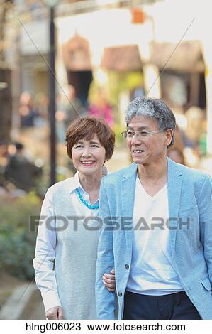 Fashionable Japanese senior couple walking downtown Tokyo View Large Photo Image Stock Image - Fashionable Japanese senior couple walking downtown Tokyo. Fotosearch