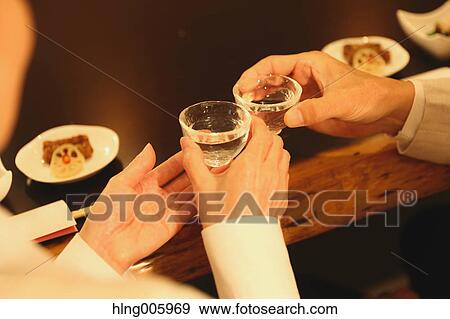 Fashionable Japanese senior couple having a good time at the restaurant View Large Photo Image Stock Photo - Fashionable Japanese senior couple having a good time at the restaurant. Fotosearch