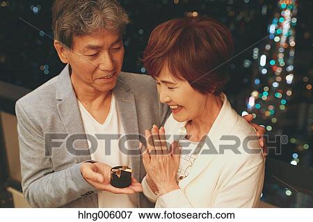 Fashionable Japanese senior couple celebrating with Tokyo cityscape in the background View Large Photo Image Stock Photo - Fashionable Japanese senior couple celebrating with Tokyo cityscape in the background. Fotosearch