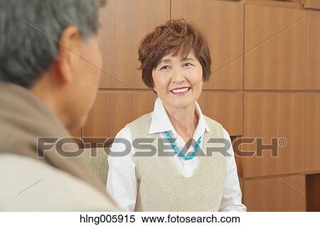 Fashionable Japanese senior couple enjoying a cup of coffee View Large Photo Image Stock Photography - Fashionable Japanese senior couple enjoying a cup of coffee. Fotosearch