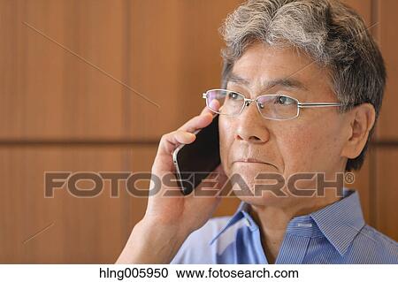 Stock Image - Fashionable Japanese senior man portrait. Fotosearch