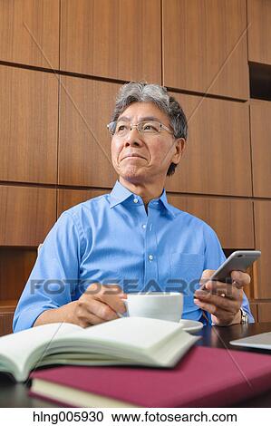 Fashionable Japanese senior man working View Large Photo Image Stock Image - Fashionable Japanese senior man working. Fotosearch