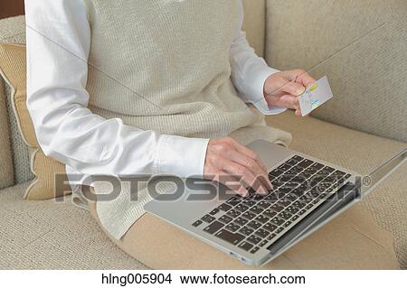 Fashionable Japanese senior woman working with laptop View Large Photo Image Picture - Fashionable Japanese senior woman working with laptop. Fotosearch