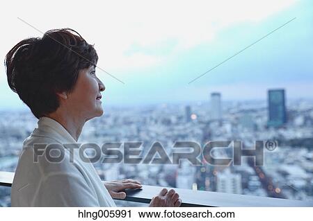 Fashionable Japanese senior woman looking at Tokyo cityscape View Large Photo Image Stock Image - Fashionable Japanese senior woman looking at Tokyo cityscape. Fotosearch