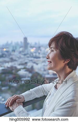 Fashionable Japanese senior woman looking at Tokyo cityscape View Large Photo Image Stock Image - Fashionable Japanese senior woman looking at Tokyo cityscape. Fotosearch