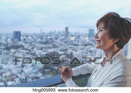 Fashionable Japanese senior woman looking at Tokyo cityscape View Large Photo Image Stock Image - Fashionable Japanese senior woman looking at Tokyo cityscape. Fotosearch