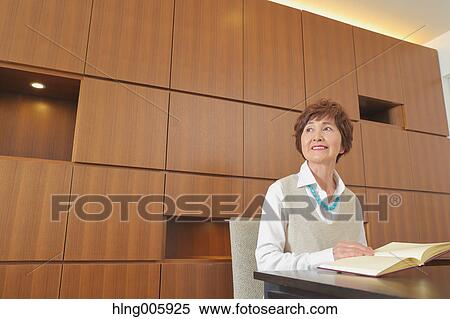 Fashionable Japanese senior woman reading book View Large Photo Image Stock Photography - Fashionable Japanese senior woman reading book. Fotosearch