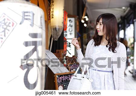 Fashionable Japanese woman at a traditional shopping street, Tokyo, Japan View Large Photo Image Stock Image - Fashionable Japanese woman at a traditional shopping street, Tokyo, Japan. Fotosearch