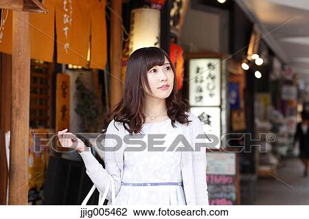 Fashionable Japanese woman at a traditional shopping street, Tokyo, Japan View Large Photo Image Stock Image - Fashionable Japanese woman at a traditional shopping street, Tokyo, Japan. Fotosearch