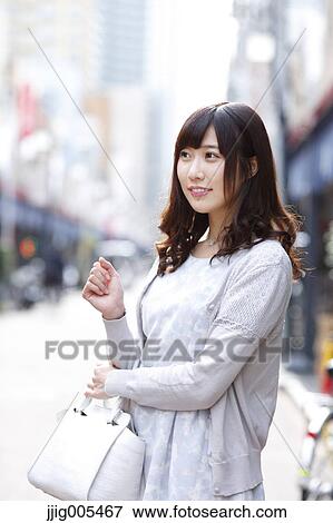 Fashionable Japanese woman at a traditional shopping street, Tokyo, Japan View Large Photo Image Stock Photo - Fashionable Japanese woman at a traditional shopping street, Tokyo, Japan. Fotosearch