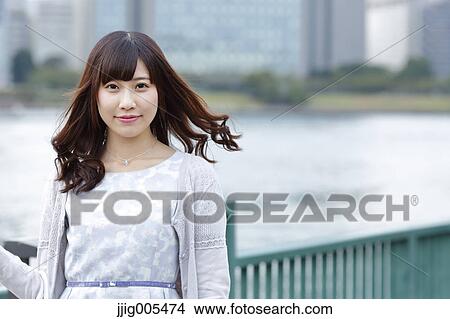 Fashionable Japanese woman by the river, Tokyo, Japan View Large Photo Image Picture - Fashionable Japanese woman by the river, Tokyo, Japan. Fotosearch