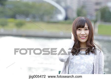 Fashionable Japanese woman by the river, Tokyo, Japan View Large Photo Image Stock Image - Fashionable Japanese woman by the river, Tokyo, Japan. Fotosearch
