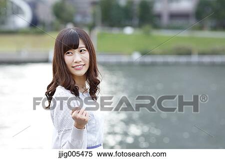 Fashionable Japanese woman by the river, Tokyo, Japan View Large Photo Image Stock Photography - Fashionable Japanese woman by the river, Tokyo, Japan. Fotosearch