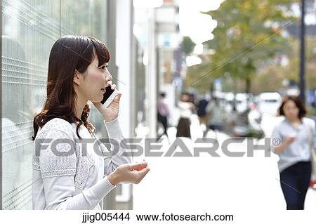 Fashionable Japanese woman on the phone in luxury Tokyo area, Tokyo, Japan View Large Photo Image Picture - Fashionable Japanese woman on the phone in luxury Tokyo area, Tokyo, Japan. Fotosearch
