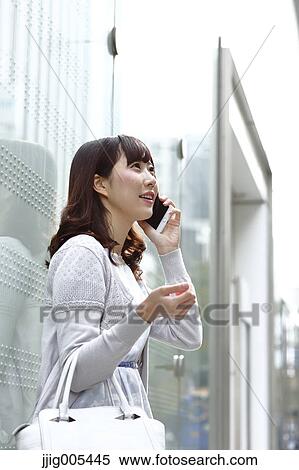 Fashionable Japanese woman on the phone in luxury Tokyo area, Tokyo, Japan View Large Photo Image Stock Photography - Fashionable Japanese woman on the phone in luxury Tokyo area, Tokyo, Japan. Fotosearch