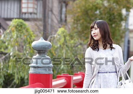 Fashionable Japanese woman walking on traditional bridge, Tokyo, Japan View Large Photo Image Stock Image - Fashionable Japanese woman walking on traditional bridge, Tokyo, Japan. Fotosearch