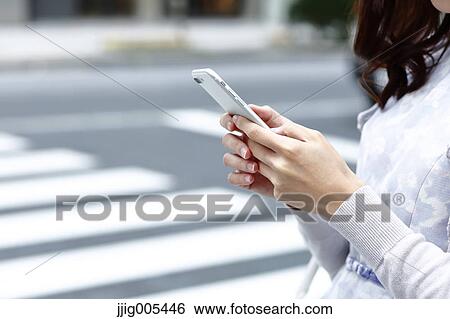 Fashionable Japanese woman with smartphone in luxury Tokyo area, Tokyo, Japan View Large Photo Image Stock Photograph - Fashionable Japanese woman with smartphone in luxury Tokyo area, Tokyo, Japan. Fotosearch