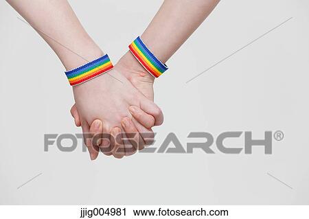 Female couple holding hands View Large Photo Image Stock Image - Female couple holding hands. Fotosearch