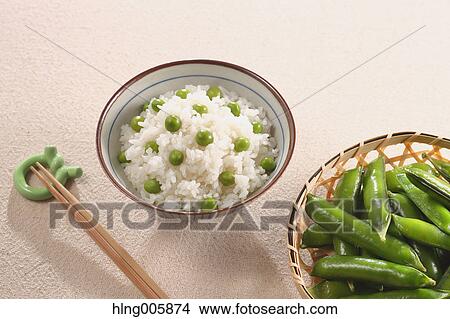 Picture - Green peas topped rice. Fotosearch