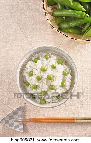 Stock Image - Green peas topped rice. Fotosearch