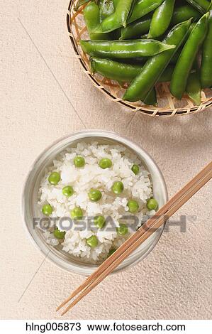 Stock Image - Green peas topped rice. Fotosearch