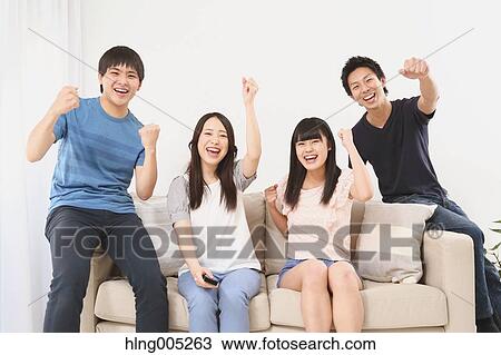 Group of Japanese supporters in the living room View Large Photo Image Stock Image - Group of Japanese supporters in the living room. Fotosearch
