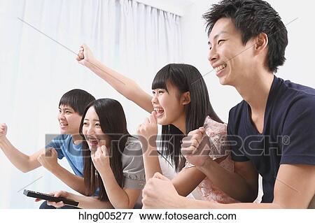 Group of Japanese supporters in the living room View Large Photo Image Stock Photo - Group of Japanese supporters in the living room. Fotosearch