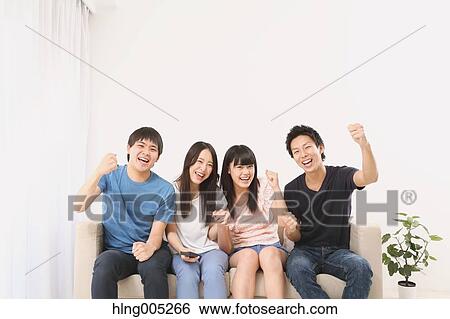 Group of Japanese supporters in the living room View Large Photo Image Stock Photograph - Group of Japanese supporters in the living room. Fotosearch