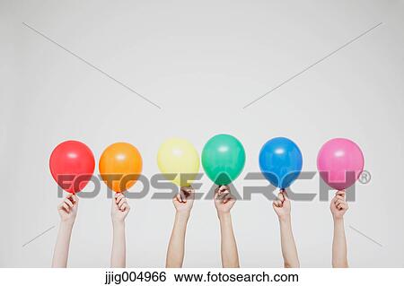Hands with balloons View Large Photo Image Stock Photograph - Hands with balloons. Fotosearch